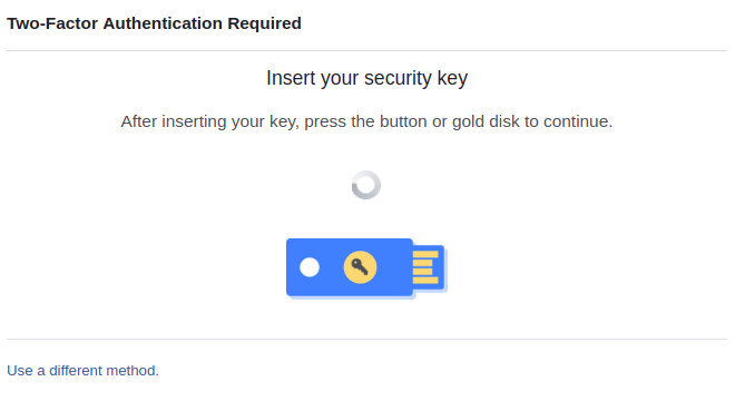 Status screen during login process, showing a Yubikey-style authentication key, and asking the user to insert and authenticate with the key.